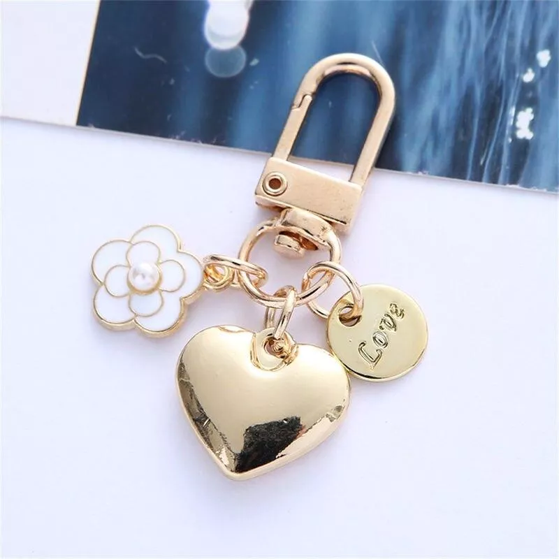 New Metal Heart Keychain Fashion Camellia Letters Round Pendant for Women Girls Headphone Case Accessorie Bag Trinket Party Gift New Metal Heart Keychain Fashion Camellia Letters Round Pendant for Women Girls Headphone Case Accessorie Bag Trinket Party Gift